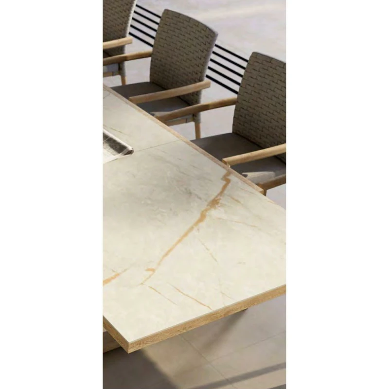 Comedor exterior con mesa extensible piedra y sillones trenzados - Imagen 2